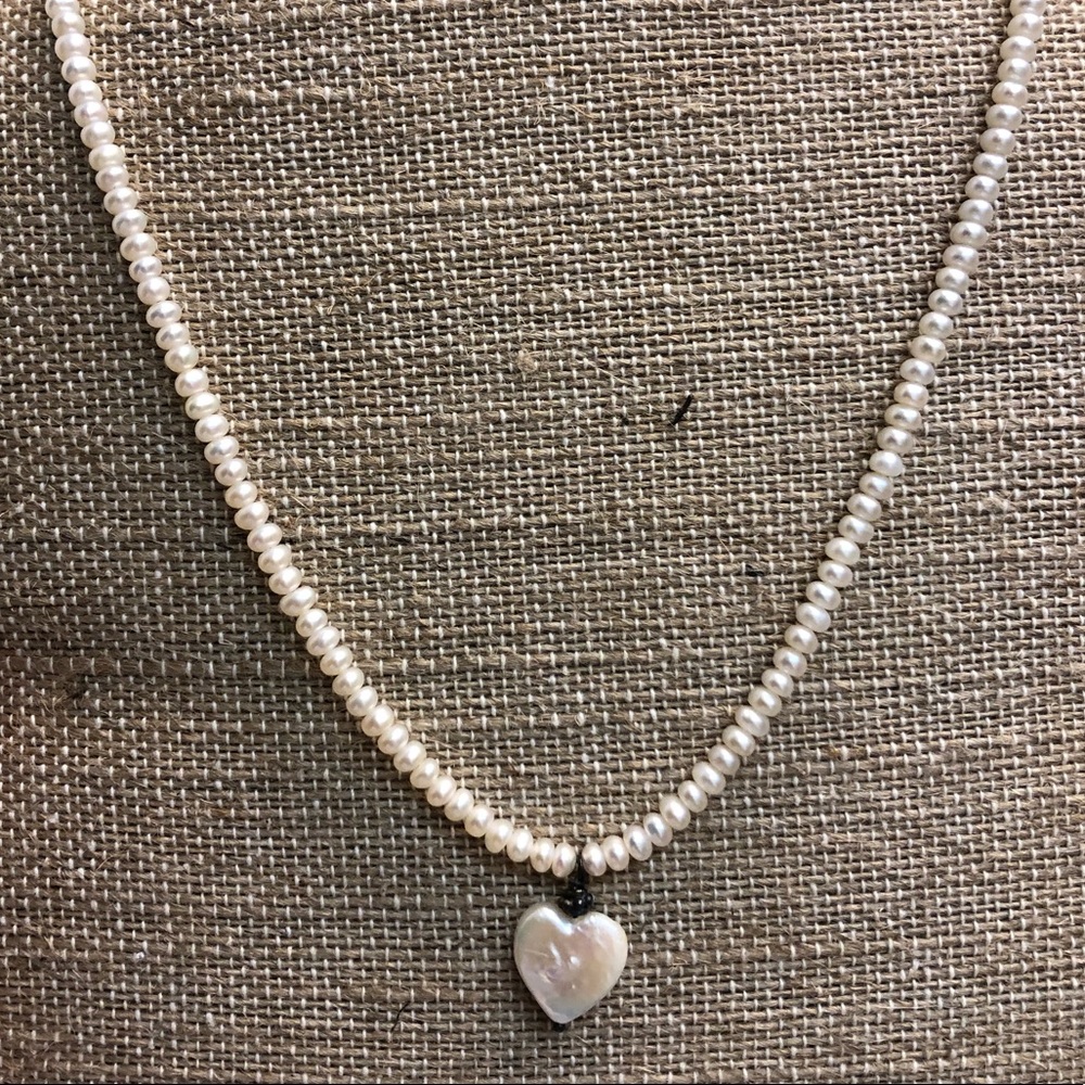White pearl chocker with heart.
